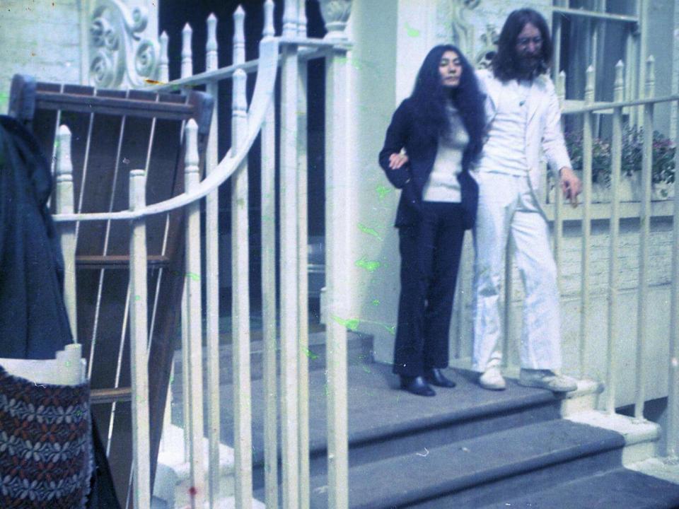 John Lennon and Yoko Ono on the steps of Apple Corps at 3 Saville Row in 1969