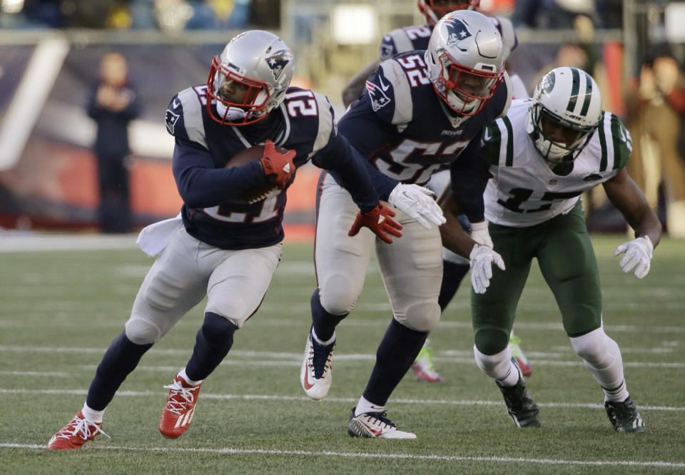 New England Patriots cornerback Malcolm Butler (21) runs with the ball after intercepting a pass intended for New York Jets wide receiver Charone Peake (17) during the second half of an NFL football game, Saturday, Dec. 24, 2016, in Foxborough, Mass. (AP Photo/Elise Amendola)