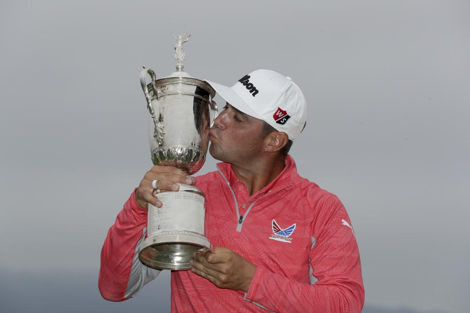 Gary Woodland posses with the trophy after winning the U.S. Open Championship golf tournament Sunday, June 16, 2019, in Pebble Beach, Calif. (AP Photo/Matt York)