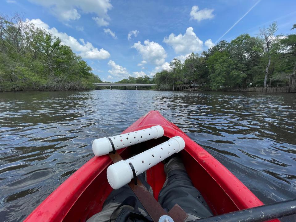 Ogeechee Riverkeeper science and policy manager Kris Howard places onset monitors upstream of the new Hyundai facility's location to track water quality. Water quality monitors are one of the ways the Vernon River's watershed management plan intends to document water quality.