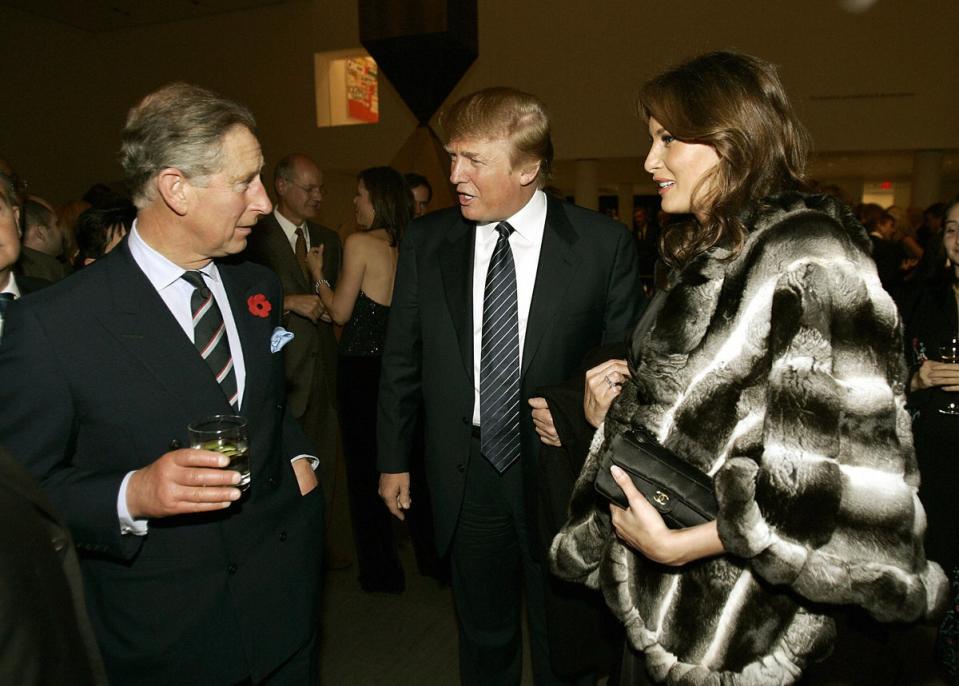 Prince Charles speaks to a future US president and first lady – Donald and Melania Trump – at the Museum of Modern Art in New York in 2005 (AFP via Getty Images)