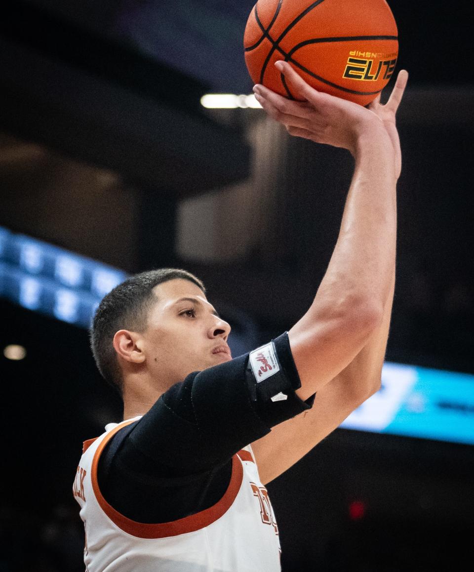 Texas forward Kadin Shedrick launches a 3-pointer against Rice at Moody Center on Wednesday. Texas won the nonconference game 80-64 while converting on more than 60% of its shots.