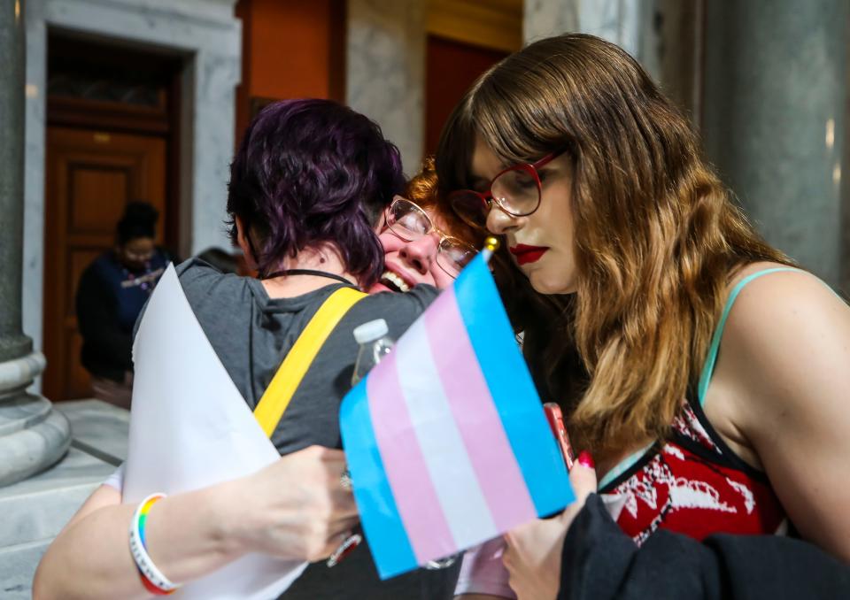 Victoria Podbilski, center, cries after the Kentucky Senate overrode Gov. Andy Beshear's veto of anti-trans Senate Bill 150. Hundreds of students from throughout Kentucky rallied in Frankfort on March 29 to oppose the bill that would ban gender-affirming care for trans youth and restrict schools from support for transgender students.