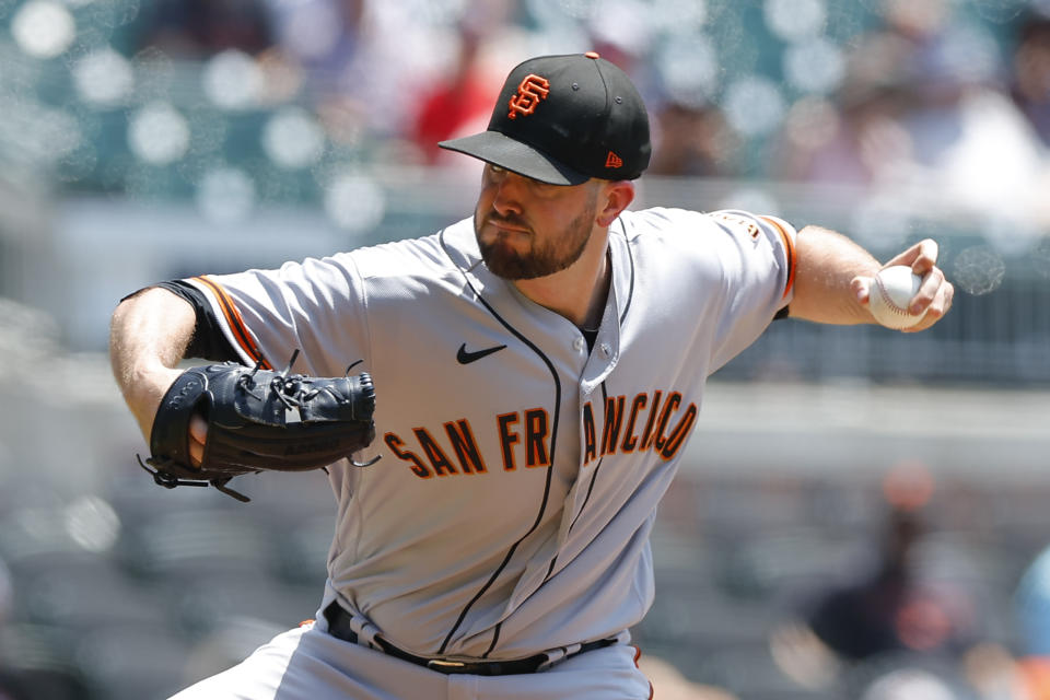 San Francisco Giants starting pitcher Alex Wood delivers in the first inning of a baseball game against the Atlanta Braves, Thursday, June 23, 2022, in Atlanta. (AP Photo/Todd Kirkland)