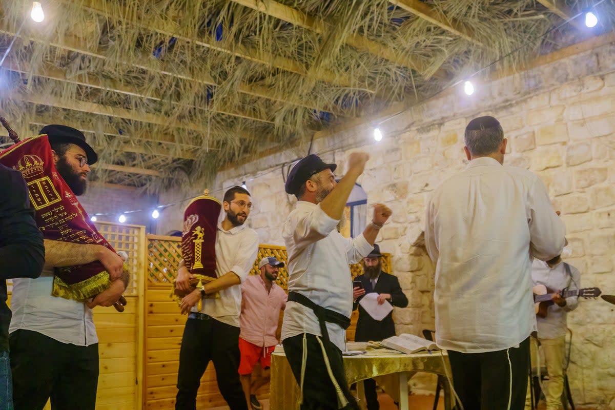 This hakafot dance which takes place around the bimah (Getty Images)