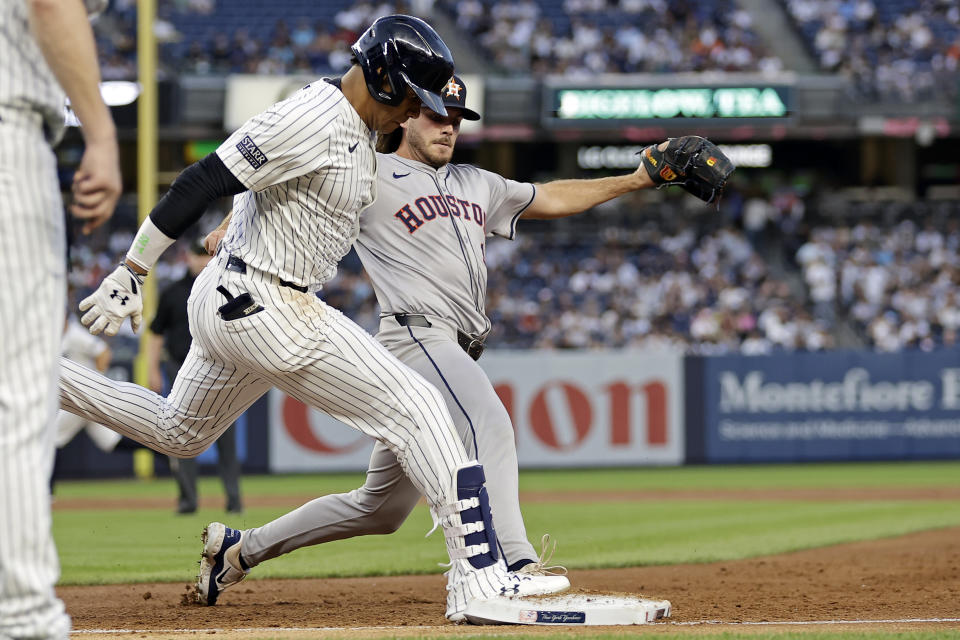 New York Yankees' Juan Soto beats Houston Astros pitcher Spencer Arrighetti to first base for a run-scoring infield single during the second inning of a baseball game Wednesday, May 8, 2024, in New York. (AP Photo/Adam Hunger)