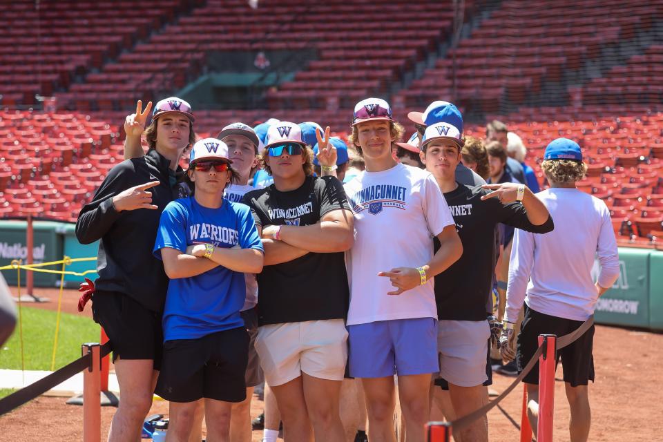 Members of the Winnacunnet High School baseball team pose for a photo during a private 30-minute team batting practice session Friday at Fenway Park.