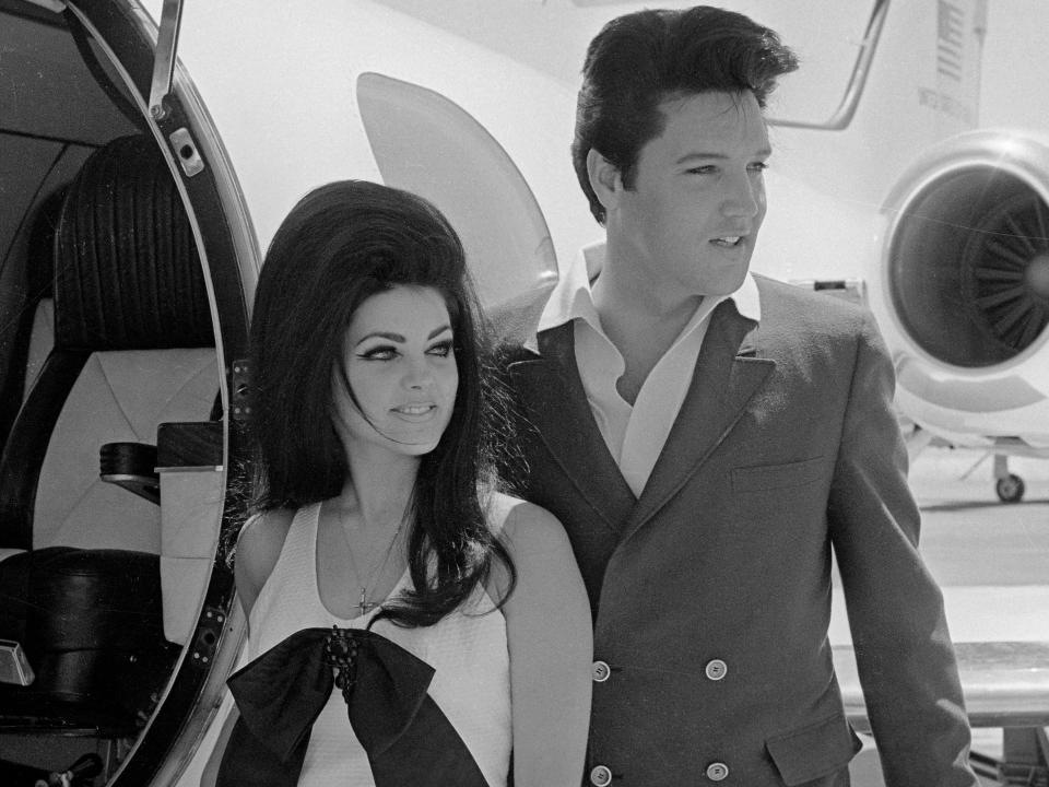 Newlyweds Elvis and Priscilla Presley, who met while Elvis was in the Army, prepare to board their private jet following their wedding at the Aladdin Resort and Casino in Las Vegas.