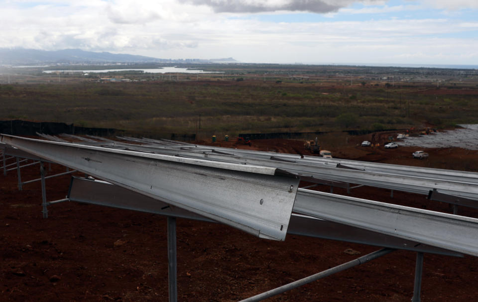 Unfinished racks for solar panels are shown at the AES Corporation's West Oahu solar farm in Kapolei, Hawaii, Tuesday, Aug. 23, 2022. As Hawaii transitions toward it goal of achieving 100% renewable energy by 2045, the state's last coal-fired power plant closed this week ahead of a state law that bans the use of coal as a source of electricity beginning 2023. (AP Photo/Caleb Jones)