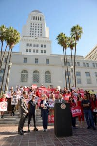 Los Angeles City Councilmember Paul Koretz speaks as Tony Kanal, animal welfare activist and bassist for the band No Doubt (2nd L) looks on during a news conference to announce the City Council vote on a ban of the sale and manufacture of fur products within the the City of Los Angeles in front of the City Hall in Los Angeles, California, U.S., September 18, 2018.   Courtesy Sheri Mandel/City of Los Angeles, City Council/Handout via REUTERS