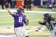 Minnesota Vikings quarterback Kirk Cousins (8) throws a pass over Tennessee Titans outside linebacker Jadeveon Clowney, right, during the second half of an NFL football game, Sunday, Sept. 27, 2020, in Minneapolis. (AP Photo/Bruce Kluckhohn)