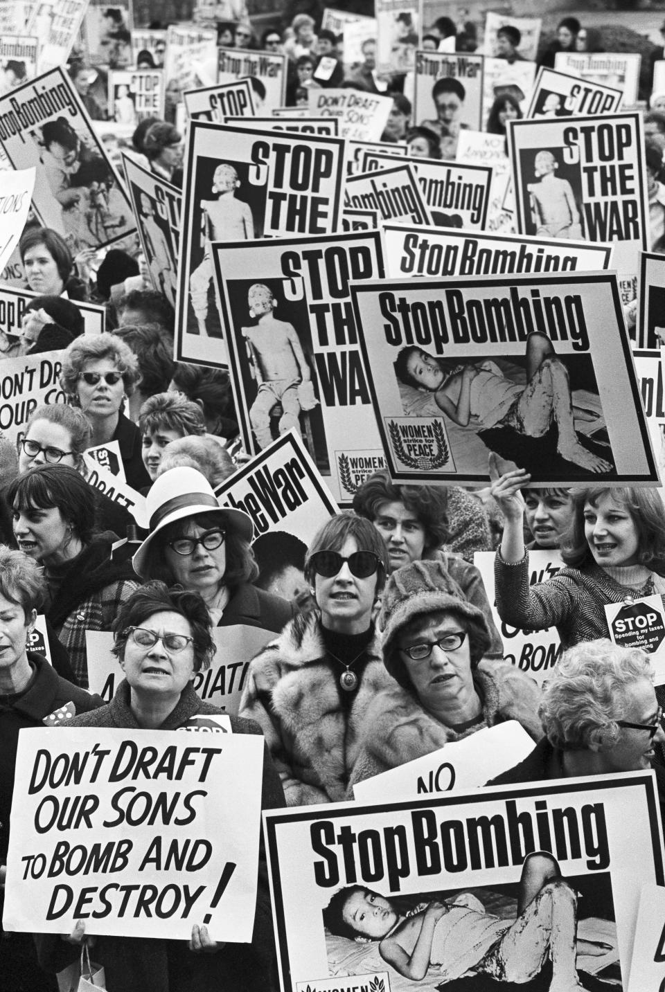 Carrying graphically illustrated anti-Vietnamese war posters, members of the 'Women's Strike for Peace' push their way to the doors of the Pentagon Building on Feb. 16, 1967. The main doors of the building were locked for 30 minutes, as the women stormed the doors in an effort to gain entrance. This photo is a close-up of the group.