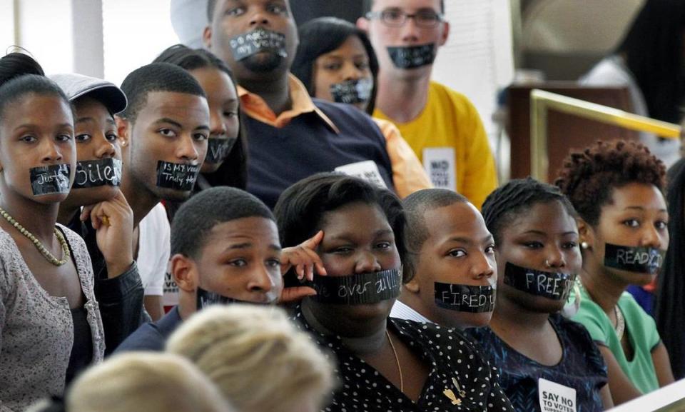 Opponents of a voter ID bill being debated at the Legislative Building in Raleigh, on April 24, 2013, wear black tape over their mouths as a sign of protest. The law was later ruled racially discriminatory and replaced by a different version in 2018 that faces similar accusations. Chris Seward/cseward@newsobserver.com