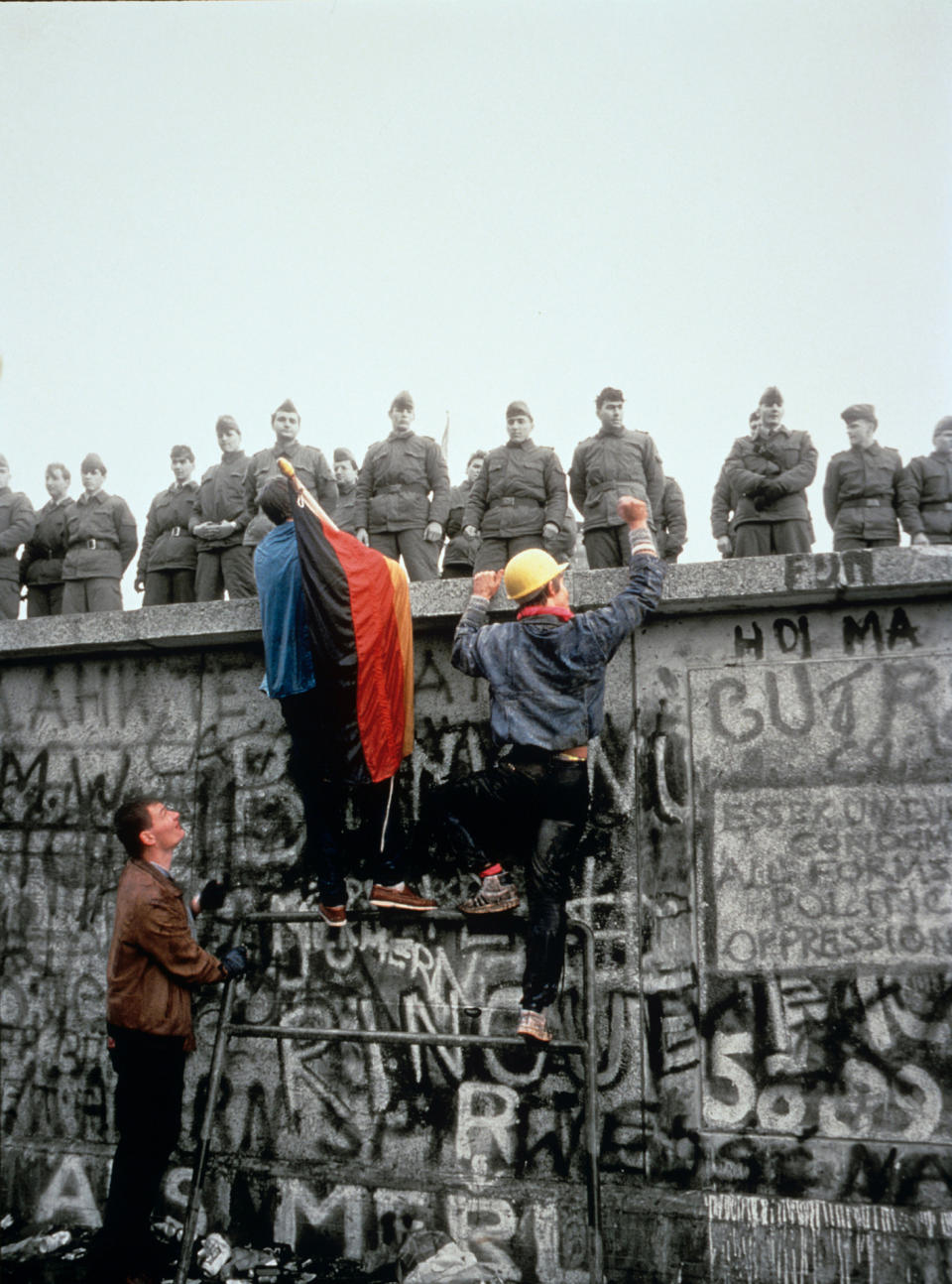 13/11/1989- West Berliners climb the Berlin Wall after border restrictions were rescinded. Picture- Corbis Images