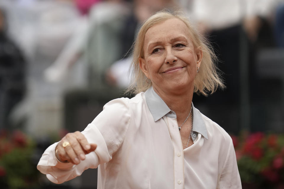 Martina Navratilova, the 18-time Grand Slam singles champion and member of the International Tennis Hall of Fame, gestures before receiving the Racchetta d'Oro (Golden Racket) award she received from the Italian Tennis Federation before the men's final tennis match at the Italian Open tennis tournament in Rome, Italy, Sunday, May 21, 2023. Former Italian tennis player Nicola Pietrangeli stands at left. (AP Photo/Alessandra Tarantino)