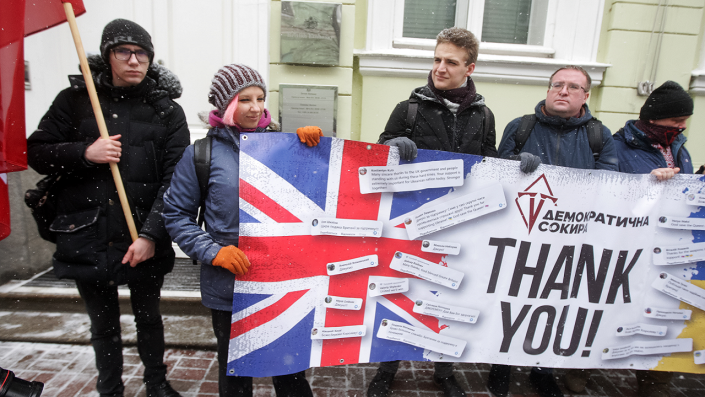 Ukrainians hold a banner as they take part at a rally to thank Great Britain for supplying Ukraine with weapons, outside the British Embassy in Kyiv, Ukraine on Jan. 21. span class="copyright"Photo by STR/NurPhoto via Getty Images/span