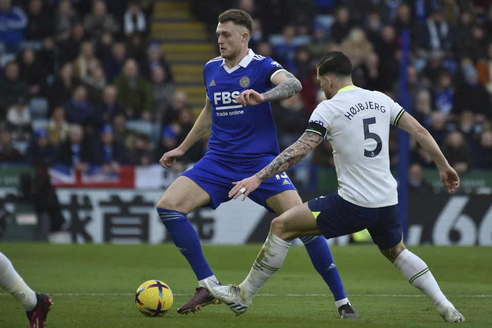 Leicester's Harry Souttar, left, challenges for the ball with Tottenham's Pierre-Emile Hojbjerg during the English Premier League soccer match between Leicester City and Tottenham Hotspur at King Power stadium in Leicester, England, Saturday, Feb. 11, 2023. (AP Photo/Rui Vieira)