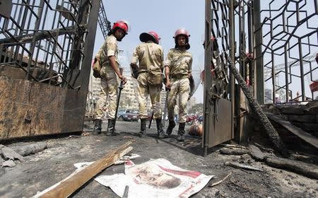 TRAMPLED: A poster of deposed Egyptian President Mohamed Mursi lies on the ground after a protest camp was cleared in August 2013. REUTERS/Mohamed Abd El Ghany