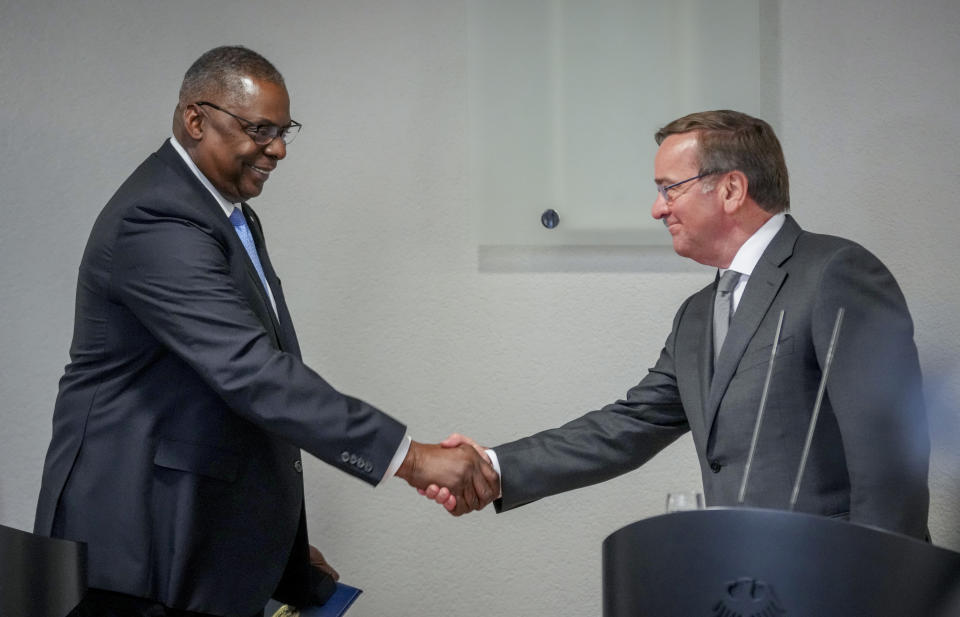 New German Defence Minister Boris Pistorius, right, and US Defense Secretary Lloyd Austin shake hands prior to a meeting at the Defence Ministry in Berlin, Germany, Thursday, Jan. 19, 2023. (AP Photo/Michael Sohn)