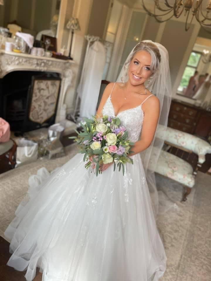 Lydia Evans-Hughes, 29, was given a lift to the church by a kind-hearted police officer after the vintage car she was travelling to her wedding in broke down (swns)