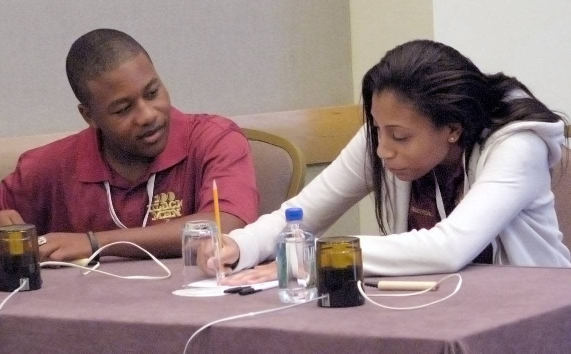 Representing Fort Lauderdale, David Reese, and Gabriella Alvarez, both 17, consult over a question during the Senior preliminary rounds of The African American History Challenge in 2010. The Challenge, a Jeopardy and Trivial Pursuit-like academic contest held each year at the national conference of mentoring group 100 Black Men of America.