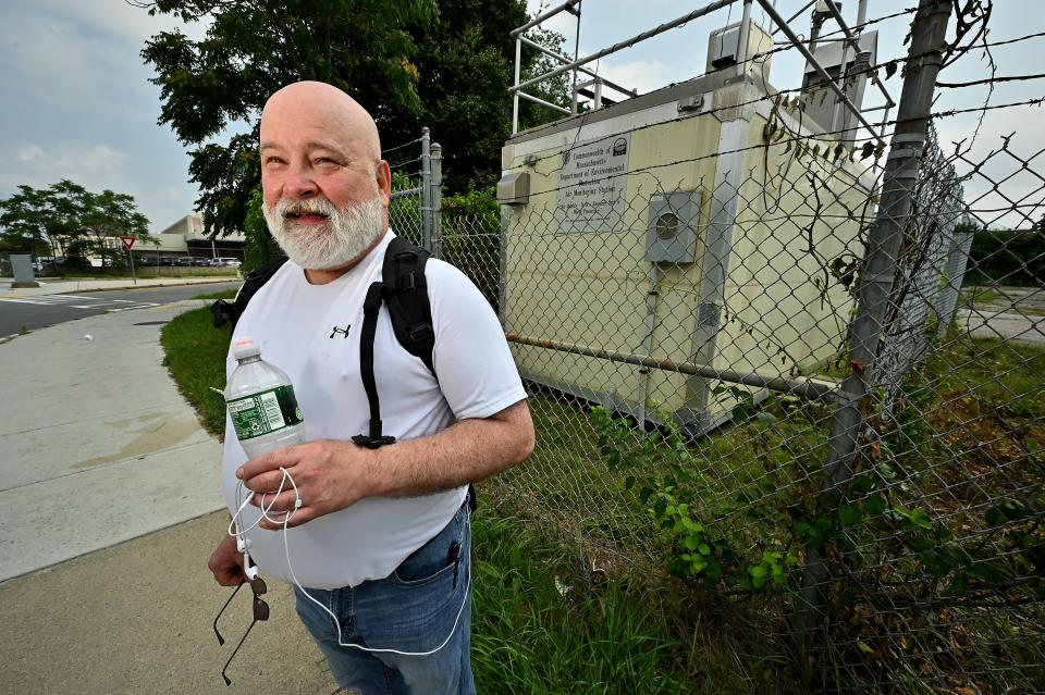 Bob Irish stands by an air-quality monitor on Summer Street in Worcester.