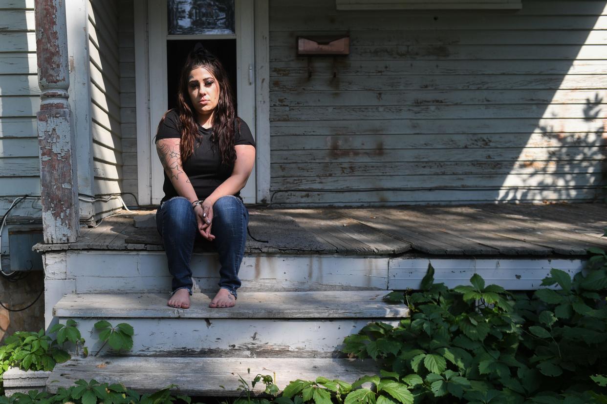 Christian Banley sits on the front patio of her Aberdeen home on Wednesday, Aug. 23, 2023.