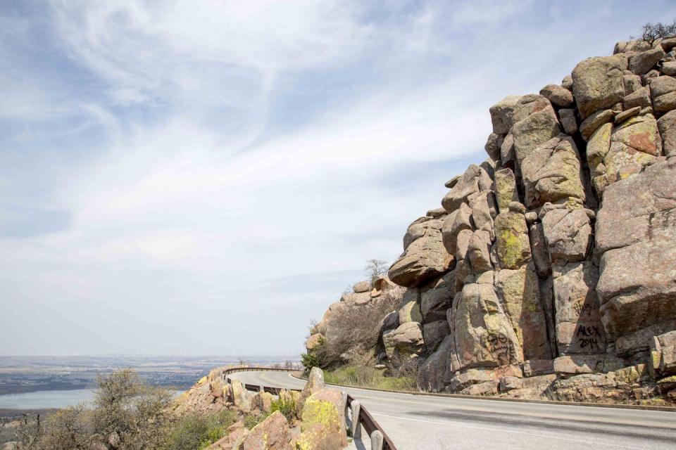 <p><strong>The Drive: </strong><a href="https://www.tripadvisor.com/ShowUserReviews-g51429-d117490-r157970694-Wichita_Mountains_National_Wildlife_Refuge-Indiahoma_Oklahoma.html" rel="nofollow noopener" target="_blank" data-ylk="slk:Wichita Mountains Scenic Byway;elm:context_link;itc:0;sec:content-canvas" class="link ">Wichita Mountains Scenic Byway</a></p><p><strong>The Scene: </strong>Located in southwestern Oklahoma, the <a href="https://www.tripadvisor.com/Attraction_Review-g51429-d117490-Reviews-Wichita_Mountains_National_Wildlife_Refuge-Indiahoma_Oklahoma.html" rel="nofollow noopener" target="_blank" data-ylk="slk:Wichita Mountains;elm:context_link;itc:0;sec:content-canvas" class="link ">Wichita Mountains</a> Scenic Byway offers some of the prettiest wildflower sightings in the spring, and amazing fall foliage views in the fall.</p><p><strong>The Pit-Stop: </strong>Climb <a href="https://www.tripadvisor.com/ShowUserReviews-g51429-d117490-r131070249-Wichita_Mountains_National_Wildlife_Refuge-Indiahoma_Oklahoma.html" rel="nofollow noopener" target="_blank" data-ylk="slk:Mt. Scott;elm:context_link;itc:0;sec:content-canvas" class="link ">Mt. Scott</a> to get a panoramic view of the surrounding mountains.</p>