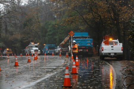 FILE PHOTO: PG&E crew work to repair damage caused by the Camp Fire in Paradise