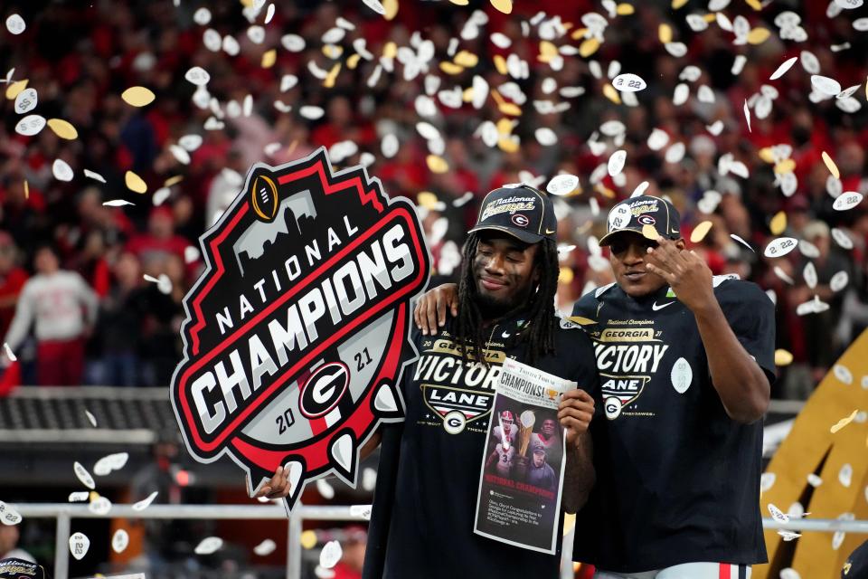 Georgia players celebrate after defeating Alabama Crimson Tide in the College Football Playoff national championship game at Lucas Oil Stadium.