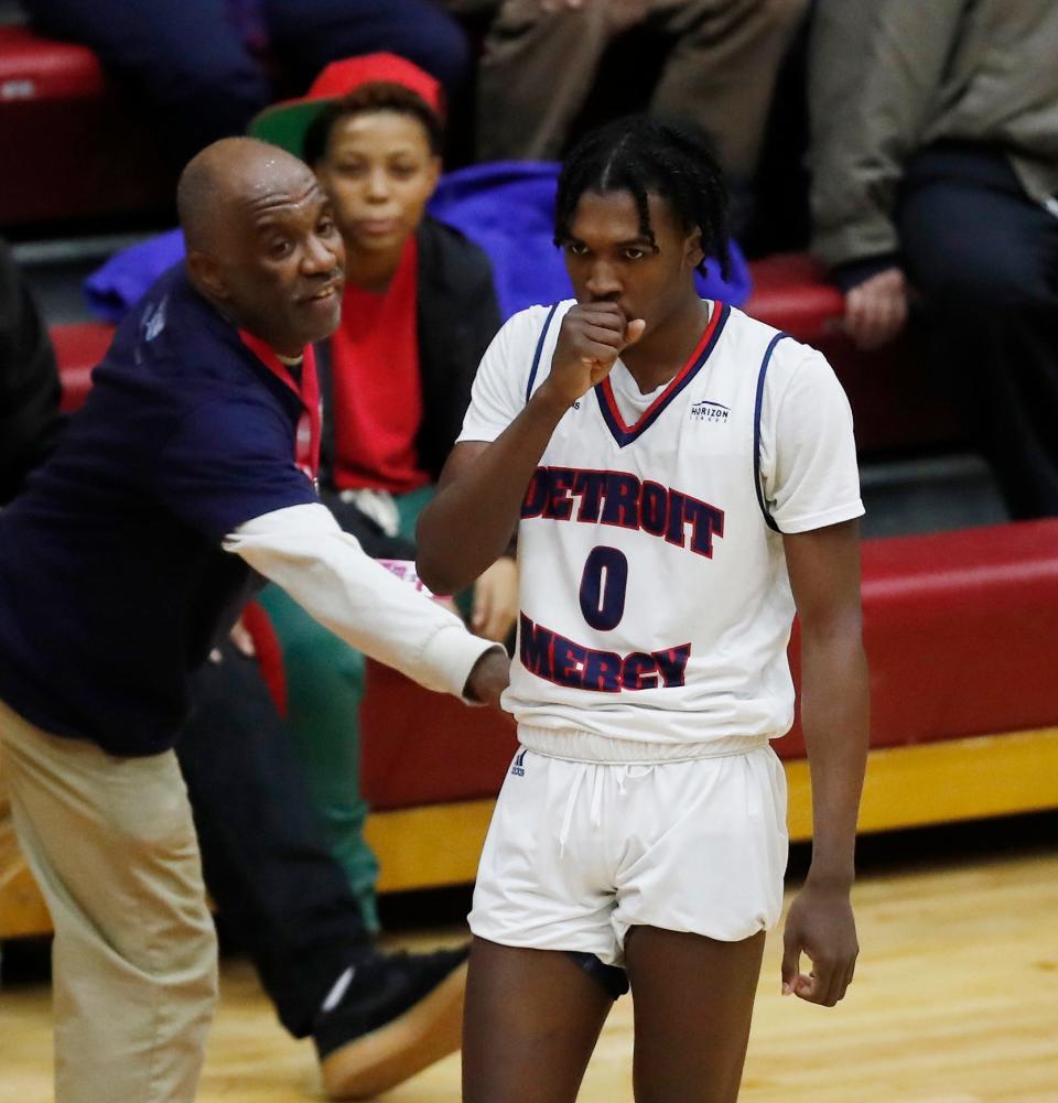 Detroit Mercy's Antoine Davis is congratulated by a fan, after breaking Stephen Curry's NCAA record for 3-pointers by a freshman in a win over IUPUI, Thursday, Feb. 28, 2019, in Detroit.