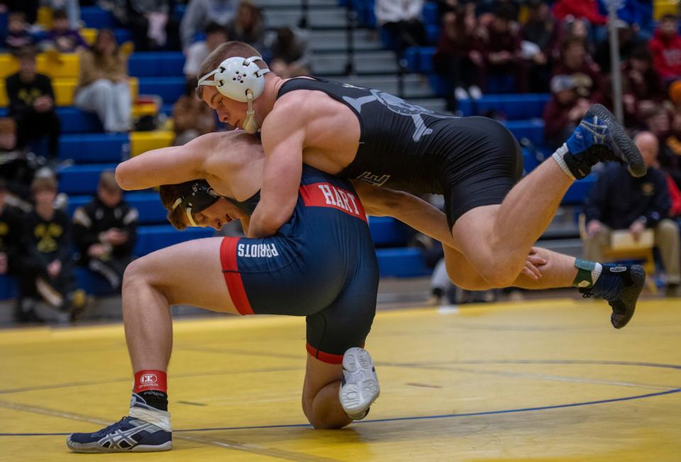 John Purdy of Castle and  Parker Hart of Heritage Hills compete in the 195-pound championship match during the 2023 IHSAA Regional Wrestling tournament at Castle High School in Newburgh, Ind., Saturday afternoon, Feb. 4, 2023.