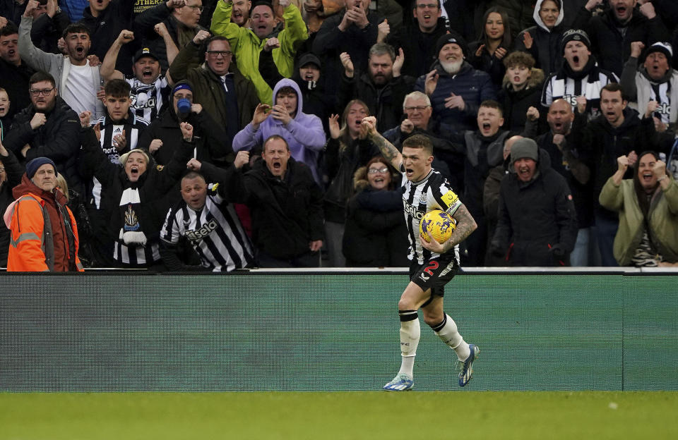 Newcastle United's Kieran Trippier celebrates scoring their side's third goal of the game during the English Premier League soccer match between Newcastle and Luton Town at St. James' Park, Newcastle upon Tyne, England, Saturday, Feb. 3, 2024. (Owen Humphreys/PA via AP)