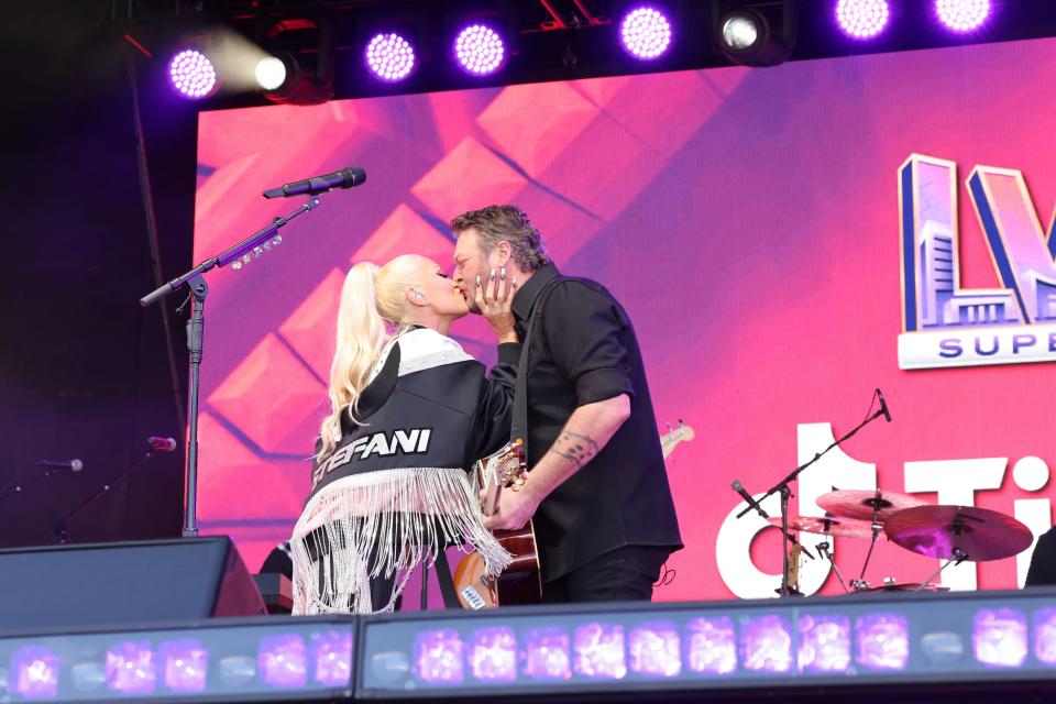 Gwen Stefani, left, and Blake Shelton kiss at the Super Bowl LVIII tailgate just days before the "No Doubt" alum flaunted a romantic Valentine's Day gift from the country crooner on "Jimmy Kimmel Live!"