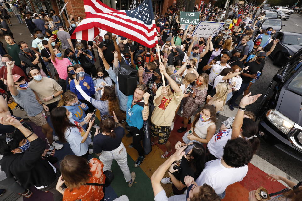 Biden supporters celebrate after major news organisations called the US 2020 Presidential Election for Joe Biden, defeating incumbent US President Donald J. Trump, at the intersection of 10th and Piedmont in Altanta.