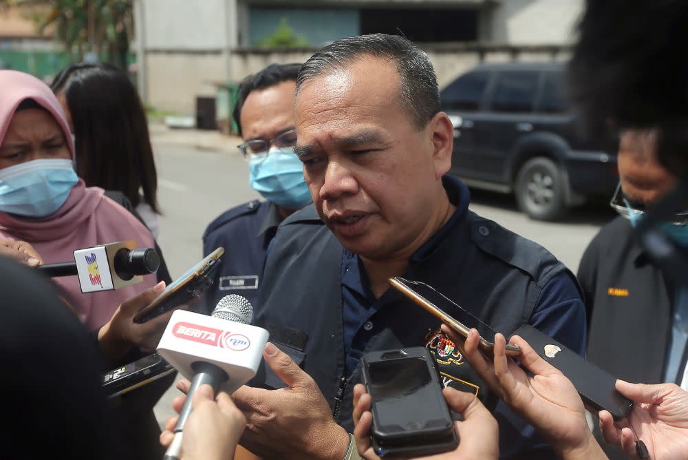 Labour Department director Mohd Asri Abdul Wahab speaks to the press after conducting checks on a worker’s hostel in Tasek, Ipoh November 26, 2020. — Picture by Farhan Najib