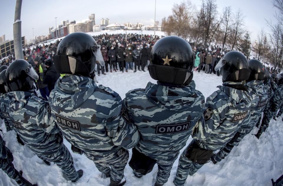 FILE - In this Jan. 23, 2021, file photo, police block a protest against the jailing of opposition leader Alexei Navalny in Yekaterinburg, Russia. Allies of Navalny are calling for new protests next weekend to demand his release, following a wave of demonstrations across the country that brought out tens of thousands in a defiant challenge to President Vladimir Putin. (AP Photo/Anton Basanayev, File)