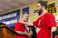 David Johnston, right, a worker at Mercedes, thanks UAW President Shawn Fain following a press conference in Tuscaloosa, Alabama on May 17, 2024, after workers at two Alabama Mercedes-Benz factories voted overwhelmingly against joining the United Auto Workers union. (AP Photo/Kim Chandler)