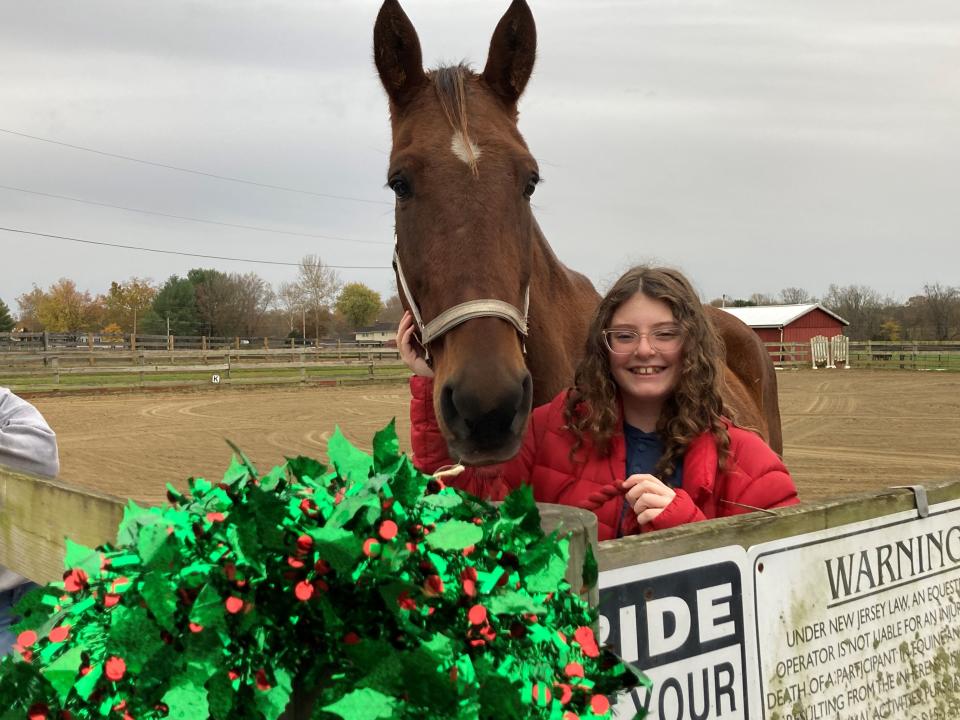 Barny, a 16-year-old horse rescued from the slaughterhouse and seen here with 11-year-old Miriam Carino, now lives at the Standardbred Retirement Foundation in Upper Freehold.