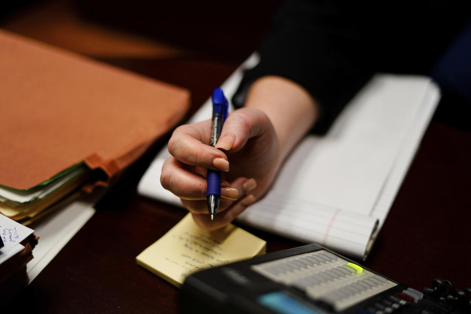 Attorney Robin Frank works in her office in Pittsburgh, Thursday, March 17, 2022. A longtime family law attorney, Frank fights for parents at one of their lowest points – when they risk losing their children. (AP Photo/Matt Rourke)