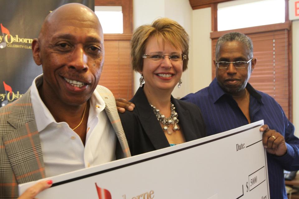 A 2013 Journal file photo of, left to right, Jeffrey Osborne, St Mary's executive director Carlene Casciano-McCann and Osborne's nephew, Terrell Osborne, holding a photo of a check that Jeffrey Osborne presented to the St. Mary's Home for Children.