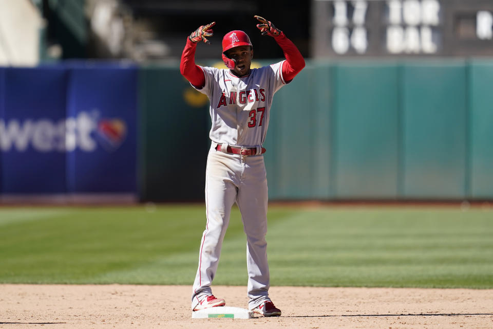 Los Angeles Angels' Magneuris Sierra gestures after hitting a RBI double during the twelfth inning of a baseball game against the Oakland Athletics in Oakland, Calif., Wednesday, Aug. 10, 2022. (AP Photo/Jeff Chiu)