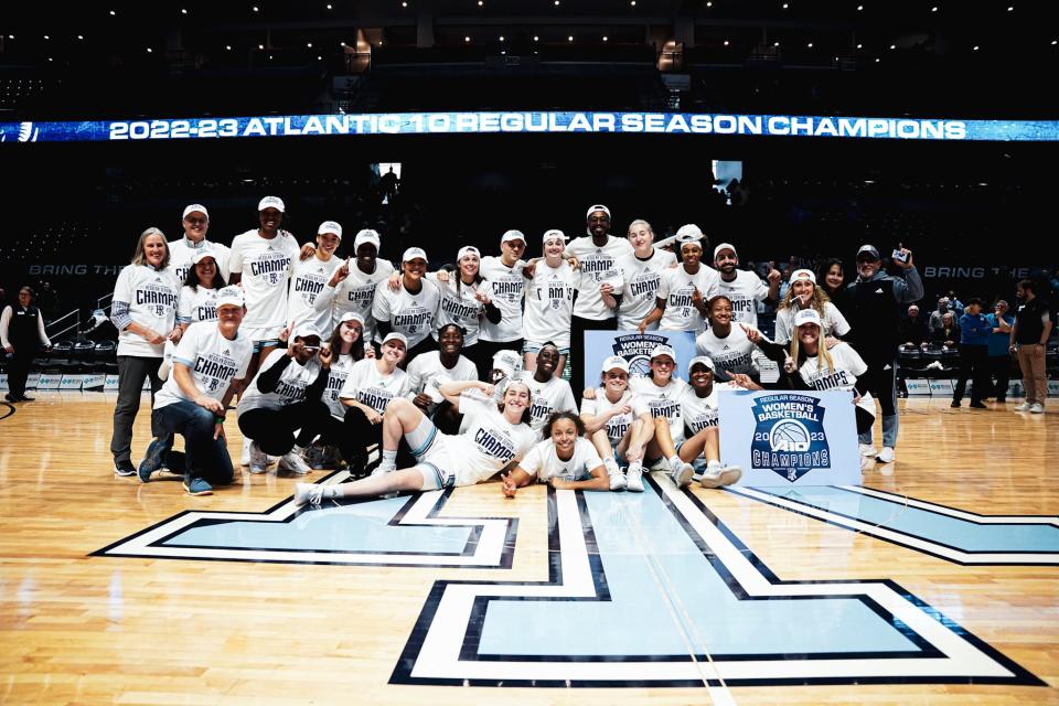 The URI players, who defeated Dayton on Saturday at the Ryan Center, pose for a photo as the Atlantic 10 regular-season cochampions.
