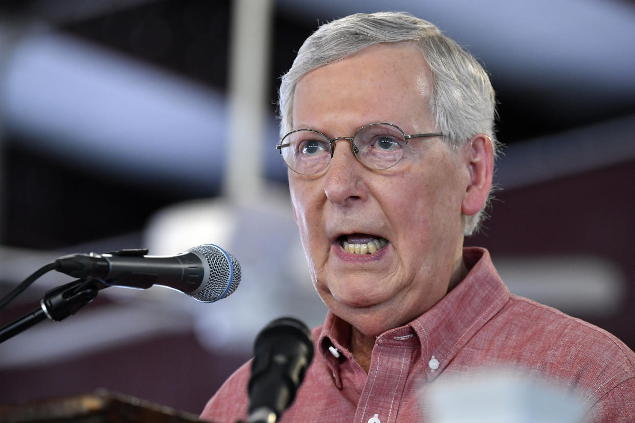 FILE - In this Aug. 3, 2019 file photo, Senate Majority Leader Mitch McConnell, R-Ky., addresses the audience gathered at the Fancy Farm Picnic in Fancy Farm, Ky. The Republican Party, the Trump campaign and other GOP organizations say they are suspending their spending on Twitter to protest the platform’s treatment of Senate Majority Leader Mitch McConnell.  Twitter temporarily locked McConnell’s campaign account after it shared a video in which some protesters spoke of violence outside his Kentucky home, where he is recovering from a shoulder fracture.   (AP Photo/Timothy D. Easley, File)