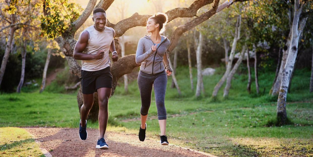 running buddies make every run better and furthershot of a young couple running in nature