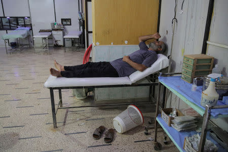 A man lies inside a hospital in Douma, outside Damascus, Syria, September 17, 2018. REUTERS/Marko Djurica