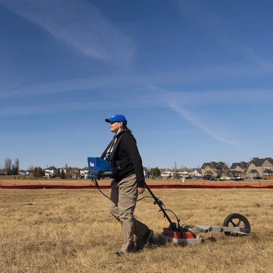 Archeologist Kisha Supernant taking readings using a ground penetrating radar. Supernant has been consulting with Indigenous communities on how the technology can best be applied to search for unmarked graves.