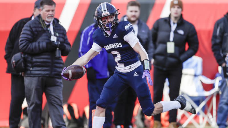 Corner Canyon Chargers’ Tate Kjar (1) runs the ball for a touchdown against the Skyridge Falcons in the 6A state football championship at Rice-Eccles Stadium at the University of Utah in Salt Lake City on Nov. 18, 2022.