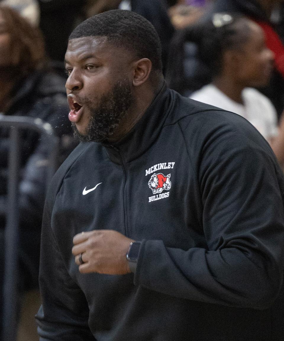 McKinley head coach Sean Weatherspoon yells instructions to his team during a boys high school basketball game at GlenOak on Thursday, December 14, 2023.
