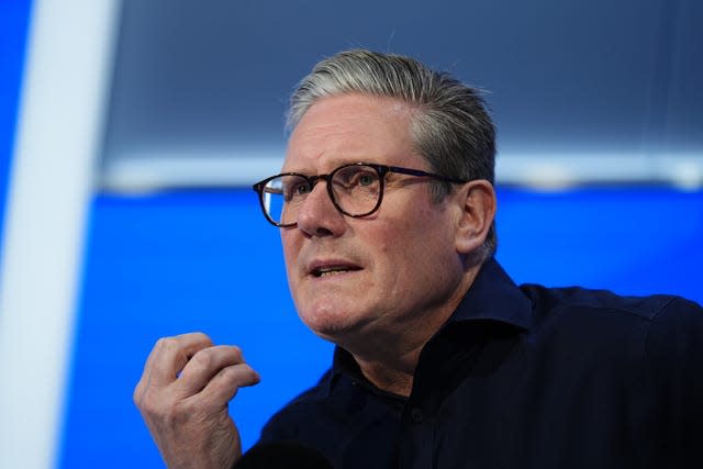 Sir Keir Starmer speaking while gesturing with his hand